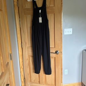HALARA Black Sleeveless Jumpsuit with Cross-Back Design